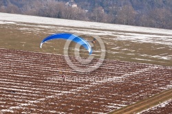 Extreme sports pilot flying with a paramotor engine and a paragl